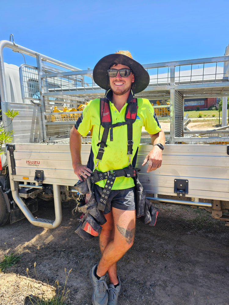 LK Roofing crew member beside the ute