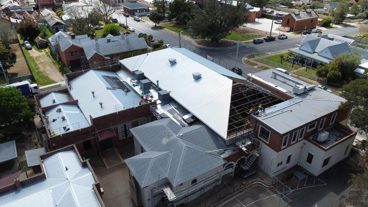 Aerial view of a commercial re-roof in progress