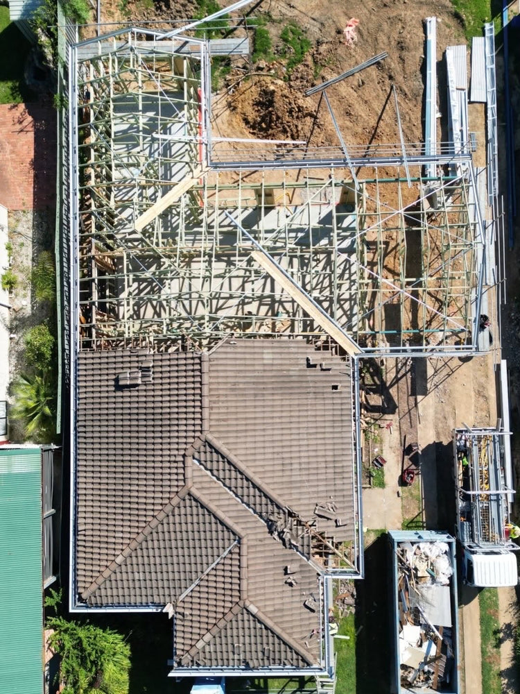 Aerial view of an extension frame joined to a tiled roof