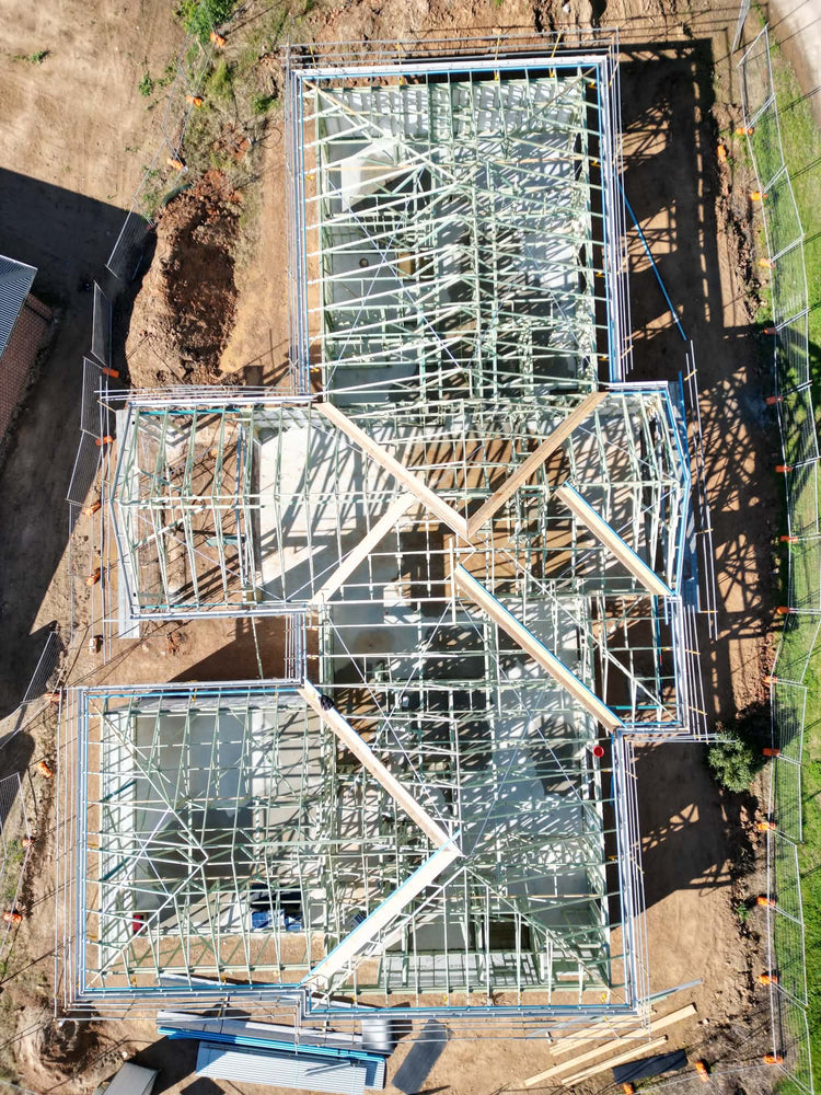 Bare steel roof frame on a new build, seen from above